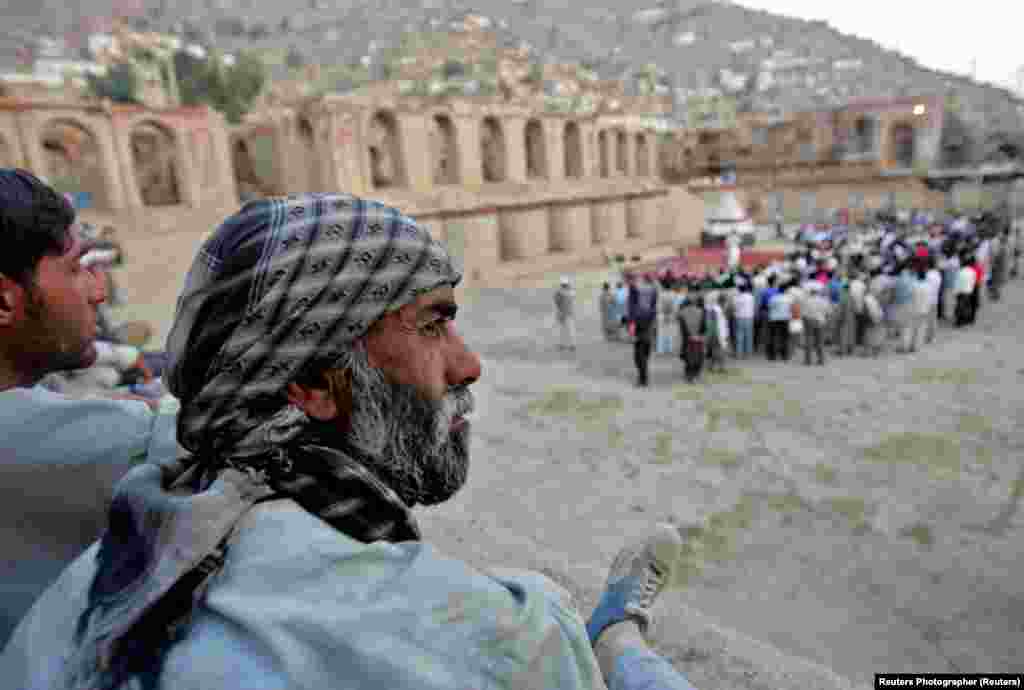 Afghans watch &quot;Love&#39;s Labour&#39;s Lost&quot; in the ruins of the royal palace in Kabul.