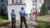 Belarusian police officers during a raid on the BelaPAN news agency in Minsk on August 7. 