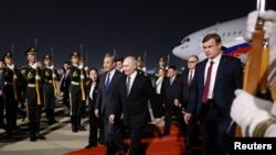 რუსეთის ფედერაციის პრეზიდენტი ვლადიმირ პუტინი და ჩინეთის საგარეო საქმეთა მინისტრი ვან ი. 19 მაისი, 2026. პეკინი