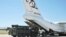 Parts of a Russian S-400 defense system are unloaded from a Russian plane at Murted Airport near Ankara in August.