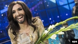 Conchita Wurst has said she would "love to spend at least a week" with Russian President Putin in order to grasp what it means to "be President Putin."