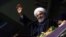 Iranian President Hassan Rohani greets supporters during a campaign rally in Hamedan on May 8.