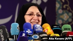 Zahra Shojaei speaks with the press after registering her candidacy earlier this month.