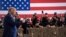 U.S. President Donald Trump gestures as he arrives for a rally at Yuma International Airport on August 18 in Yuma, Arizona.