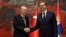 Turkish President Recep Tayyip Erdogan (left) meets Serbian President Aleksandar Vucic in Belgrade on October 11. 