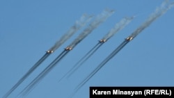 Armenia - Armenian Su-25 warplanes fire rockets during CSTO military exercises near Yerevan, 16Sep2012.