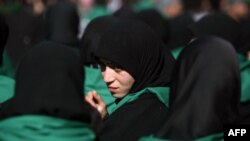 Iraq - A Shiite Muslim woman attends the Arbaeen religious festival in the shrine city of Karbala, 03Jan2013