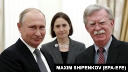 Russian President Vladimir Putin (left) meets with U.S. national-security adviser John Bolton in the Kremlin on October 23.