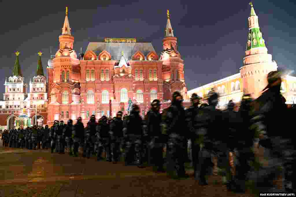 Security forces march through Moscow&#39;s Manezh Square.