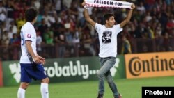 Armenia - Opposition activist Shahen Harutiunian invades the pitch during an Armenia-Portugal football game at the Republican Stadium in Yerevan, 13Jun2015.