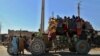 Afghans flee their villages after fighting intensified between Taliban militants and security forces in Lashkar Gah on October 12.