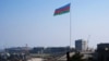 Azerbaijan -- An enormous Azerbaijani flag flies above the construction site of the 2012 Eurovision concert hall on the Caspian Sea shoreline in Baku, 14Jan2012