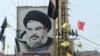 A portrait of the head of the Lebanese Shi'ite movement Hezbollah, Hassan Nasrallah, is seen in southern Lebanon, 