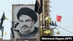 A portrait of the head of the Lebanese Shi'ite movement Hezbollah, Hassan Nasrallah, is seen in southern Lebanon, 