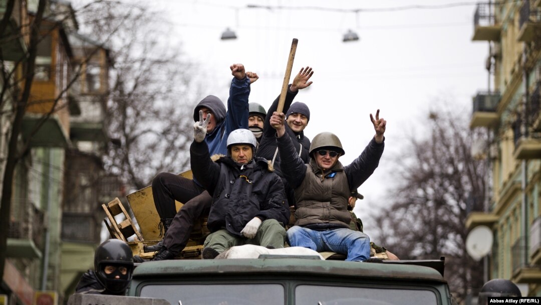 Jubilant Euromaidan activists patrol the center of Kyiv after the departure of ousted Ukrainian President Viktor Yanukovych on the weekend. 