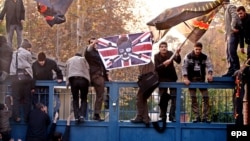 Iranian students break into the British embassy in Tehran in November 2011. The United Kingdom closed its embassy in the Iranian capital shortly after attacks on the facility in connection with London's support for increased international sanctions against Iran.