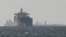 Cargo ships sail in the Gulf near the Strait of Hormuz (file photo)