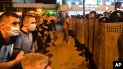 Police block demonstrators during a rally after the Belarusian presidential election in Minsk on August 9.