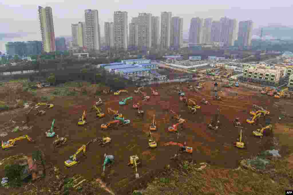 Excavators at the construction site of a new hospital being built to treat patients from the deadly outbreak of the coronavirus in Wuhan in China&#39;s central Hubei Province. China is rushing to build a new hospital in a staggering 10 days to treat patients at the epicenter of the outbreak that has killed at least 56 and infected almost 2,000 others. (AFP/Stringer)