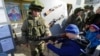 Children play with military equipment at a celebration of the Russian Defender of the Fatherland Day in Simferopol, Crimea, in February 2020.