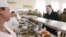 Ukrainian President Petro Poroshenko (right) queues for food with soldiers in the mess hall during his visit to the 95th Airborne Brigade in Zhytomyr on March 11.