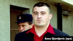 Sasa Cvjetan arrives at the Court of Justice in the Serbian town of Prokuplje on October 9, 2002.