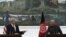 U.S. Secretary of Defense Chuck Hagel (left) gestures while speaking during a joint news conference with Afghan President Ashraf Ghani at the Presidential Palace in Kabul on December 6.