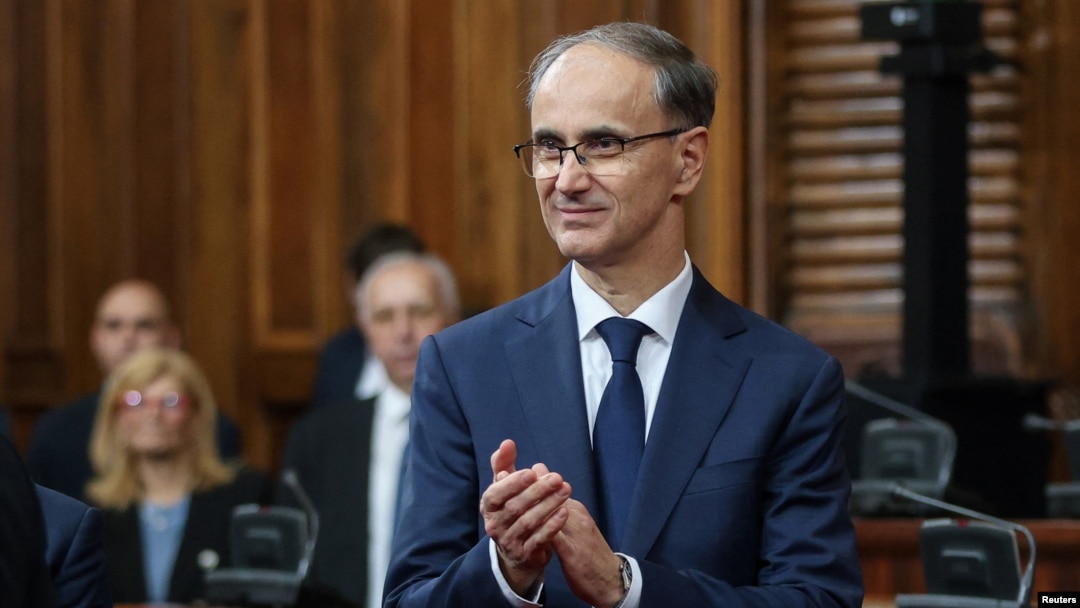 Serbian Prime Minister Djuro Macut smiles after his swearing-in ceremony at the parliament in Belgrade on April 16. 