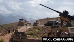 U.S. Army from NATO and Afghan commando forces at a checkpoint during a patrol against Islamic State militants in Deh Bala district in Nangarhar Province in July 2018