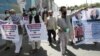 Former Afghan interpreters who worked with U.S. troops in Afghanistan demonstrate in front of the U.S. Embassy in Kabul on June 25.