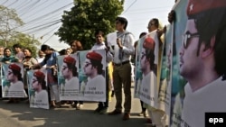 Pakistani civil society activists hold portraits of Mashal Khan who was killed by a mob of his fellows students for alleged blasphemy in Abdul Wali Khan University in April.