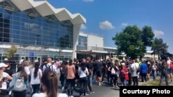 Protesters in Novi Sad pay tribute on May 1 to victims of the railway station canopy collapse that sparked nationwide demonstrations