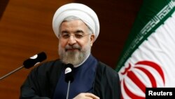 Iranian President Hassan Rohani addresses the audience during a meeting in Ankara on June 10.