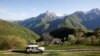 A vehicle carrying health-care workers and a Red Cross volunteer drive to a mountain village in the remote Kolasin region of central Montenegro.