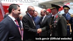 Turkish President Recep Tayyip Erdogan (center) is welcomed upon his arrival in Baku on July 10. 