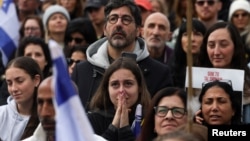 People gather in Tel Aviv ahead of the release of six Israeli hostages from Hamas captivity on February 22.