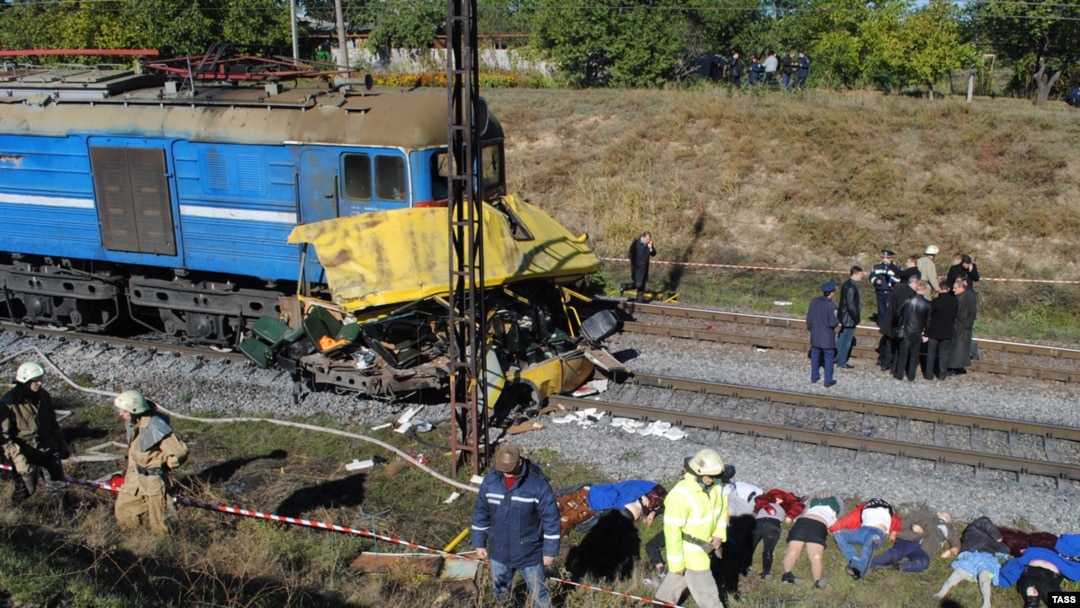 Police officers and firefighters work at the crash site in Ukraine's Dnipropetrovsk region.