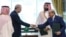 Turkey's President Recep Tayyip Erdogan (L) shaking hands with Pakistan’s Prime Minister Shehbaz Sharif as Saudi Arabia's Crown Prince Mohammed bin Salman (2nd R) looks on after signing a joint defence agreement in Mecca.