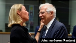 European Union foreign policy chief Federica Mogherini (left) and Spanish Foreign Minister Josep Borrell at the EU foreign ministers' meeting in Brussels on July 15.