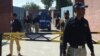 A Pakistani anti-terrorism court official arrives in an armored vehicle at Adyala Prison in Rawalpindi