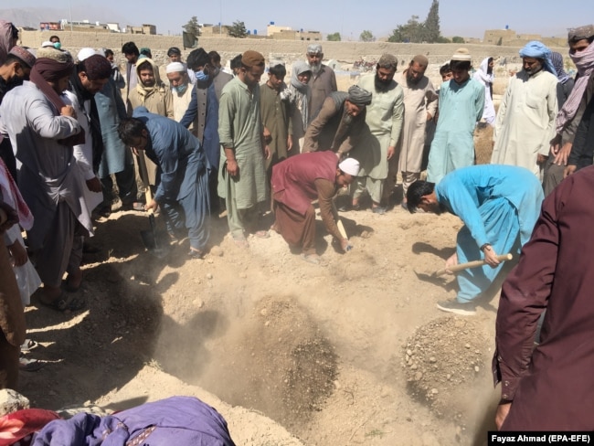 Mourners attend the funeral of victims killed in a suicide bomb blast at a hotel in Quetta, the provincial capital of Balochistan Province, in April 2021.