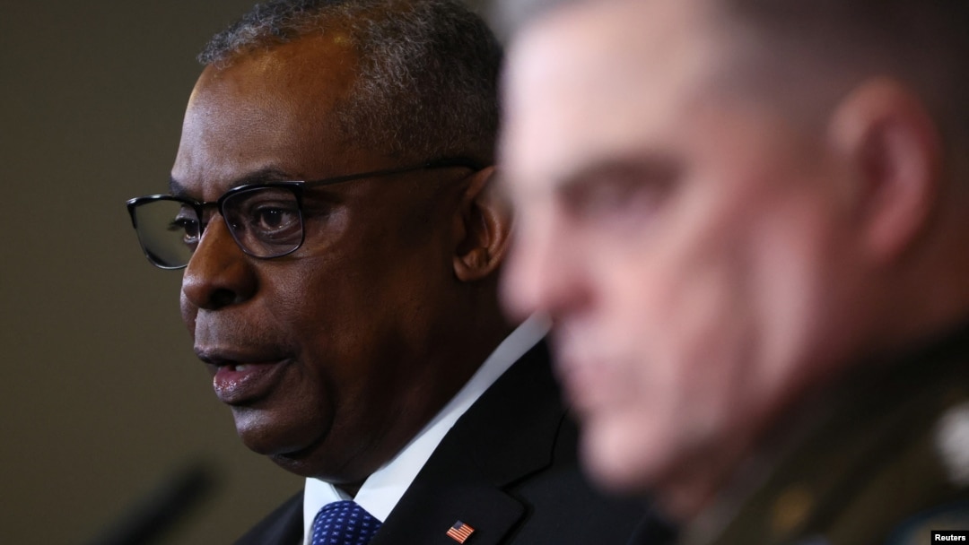 U.S. Secretary of Defense Lloyd Austin (left) and the chairman of the U.S. Joint Chiefs of Staff, General Mark A. Milley, speak to reporters in Germany on January 20.