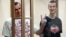 Ukrainian film director Oleh Sentsov (left) and his fellow defendant Oleksandr Kolchenko in court in the city of Rostov-on-Don in August 2015