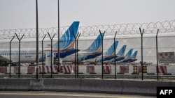 FlyDubai planes parked on the tarmac at Dubai airport on March 2