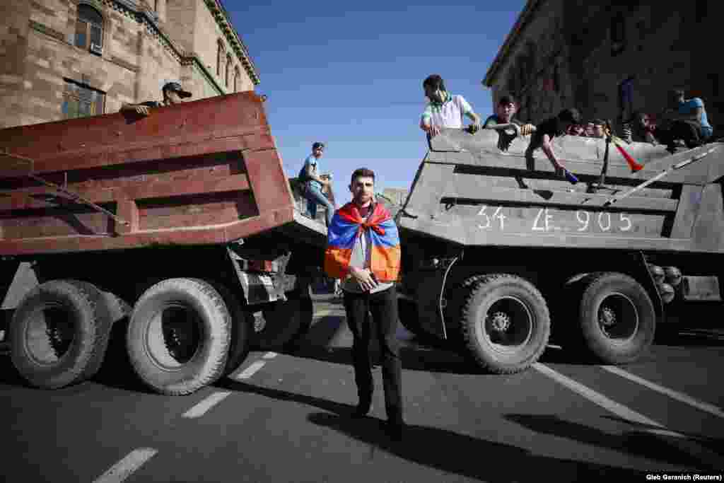 Armenian protesters block a road after opposition leader Nikol Pashinian announced a nationwide campaign of civil disobedience in Yerevan on May 2. (Reuters/Gleb Garanich)