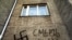 An anti-Semitic slogan and a Nazi swastika drawn on a house in Vladivostok, Russia.