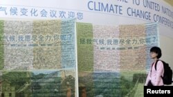Plakati na ulicama Tianjina, tokom konferencije o klimatskim promjenama, listopad 2010