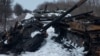 UKRAINE – A charred Russian tank and captured tanks are seen, amid Russia's invasion of Ukraine, in the Sumy region, Ukraine, March 7, 2022. Picture taken March 7, 2022