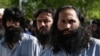 Taliban prisoners stand during their release from the Bagram prison some 50 km north of Kabul on May 26.