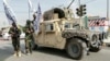 Taliban fighters pose in Ghazni on August 15, the fourth anniversary of the group seizing power in Afghanistan. 